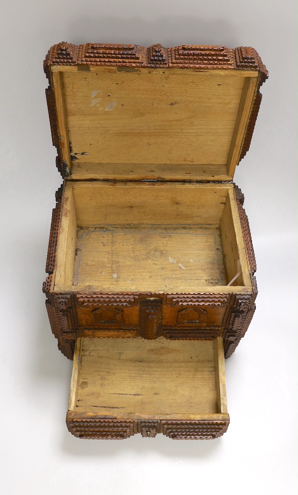 A late 19th century Tramp art elaborately chip-carved wood casket. 24cm high